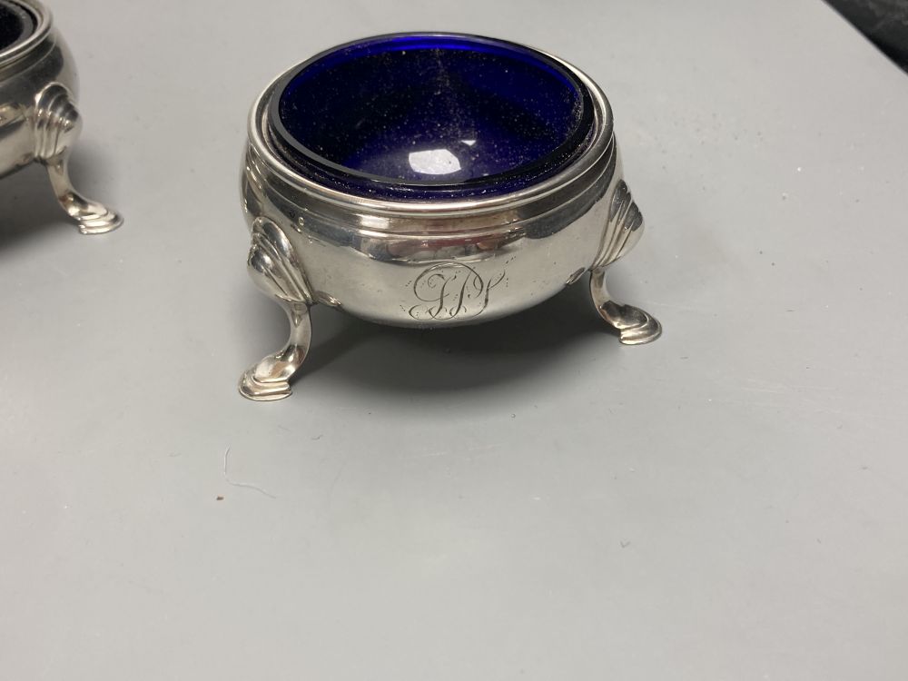 A pair of Georgian silver circular salts, a George III urn-shaped pepper pot and 4 various spoons.